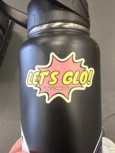 Customer's custom vinyl sticker with a white border shown on a black water bottle.