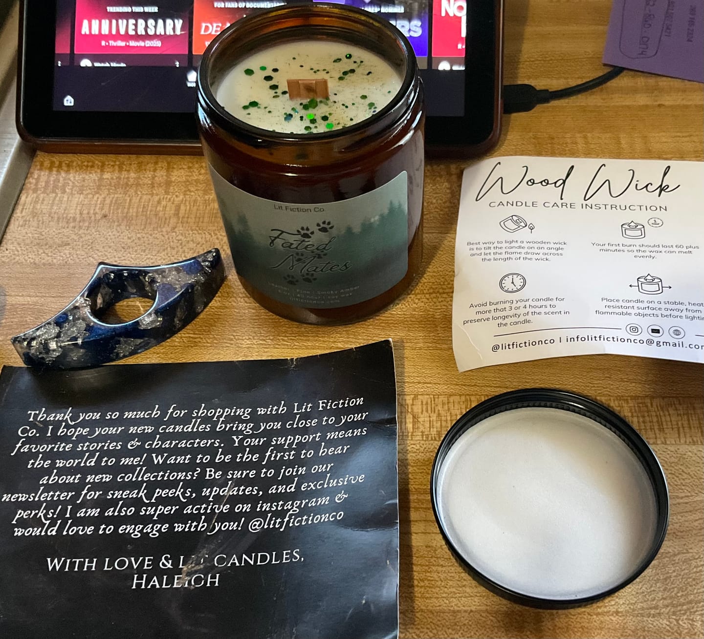 Customer photo review of Fated Mates | Wolf Shifter Candle | Leather + Pine + Smoky Amber | 8 oz Wood Wick Bookish Candle