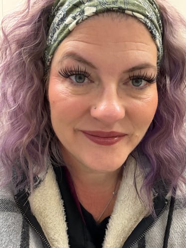 Close-up of a customer wearing long, wispy Sylph false eyelashes that give her eyes a charming lift.