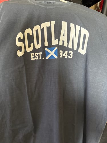 Customer's dark gray Scotland Varsity Flag T-Shirt, showing the arched 'SCOTLAND' text and flag graphic.