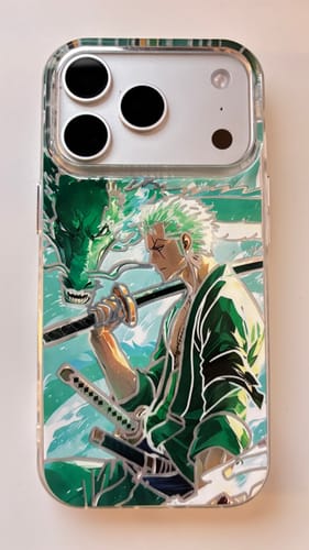 Customer's clear phone case with a green anime design of a swordsman and dragon.