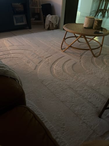 Customer's plush Vanilla Cream Mellow Mat with a carved design in their living room.