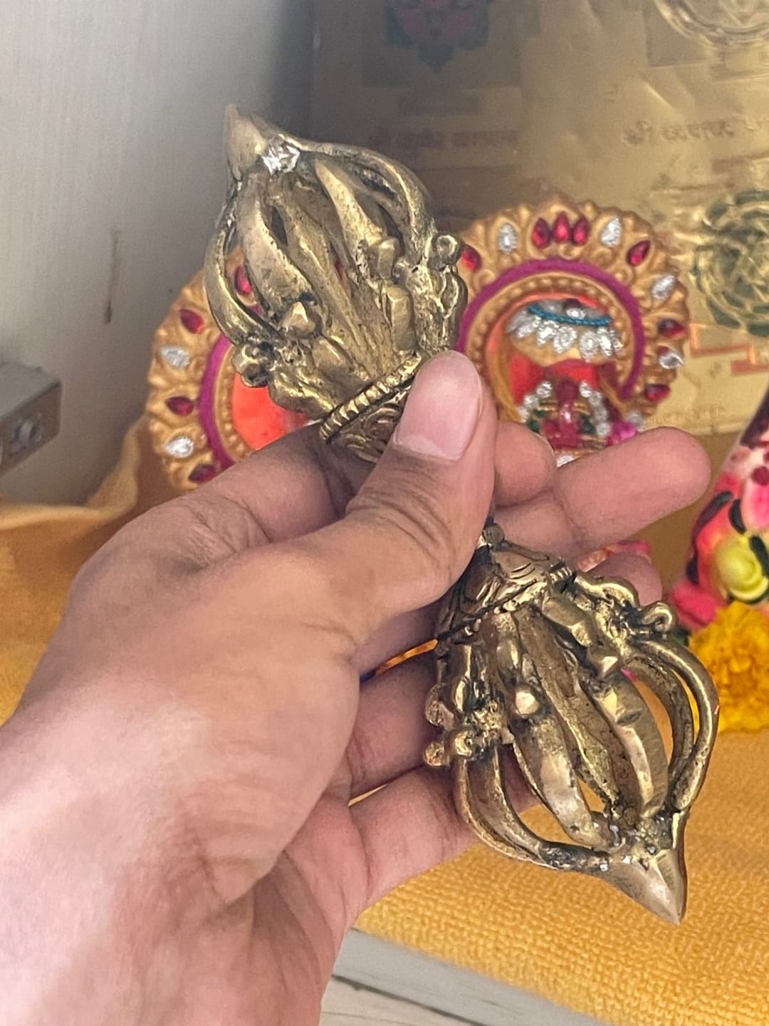 Customer photo review of Brass Vajra Dorje Ritual Tool Vastu Remedy for Protection, Tibetan Meditation and Home Temple Energy 15.7 x 4 cm | 340 gm