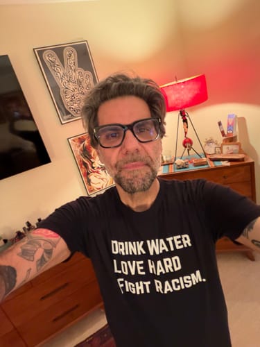 Customer photo review of Drink Water Fight Racism Unisex T-shirt