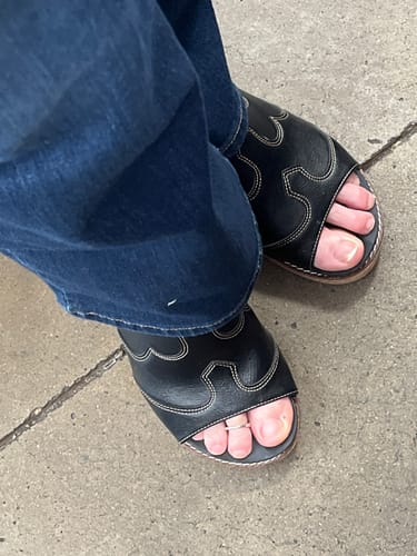 Customer's close-up of the Corkys Black Neon Moon Sandals, showing the detailed sculpted upper.