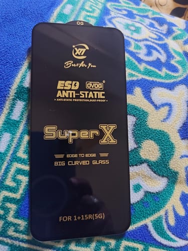 Customer shows the UltraShield Tempered Glass with its black anti-static film prior to installation.