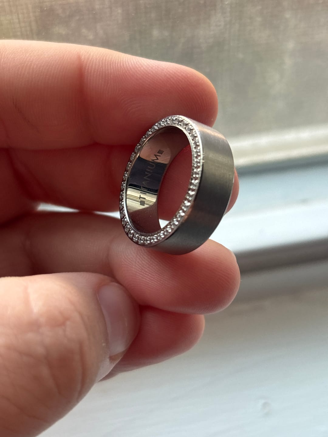 Customer photo review of Men's Silver Titanium Wedding Band Brushed with Double Sided Full CZ Diamonds -8mm