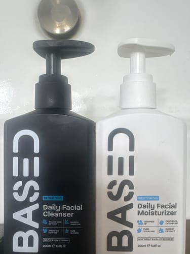 Customer's Daily Skincare Duo, featuring the black cleanser and white moisturizer pump bottles side-by-side.
