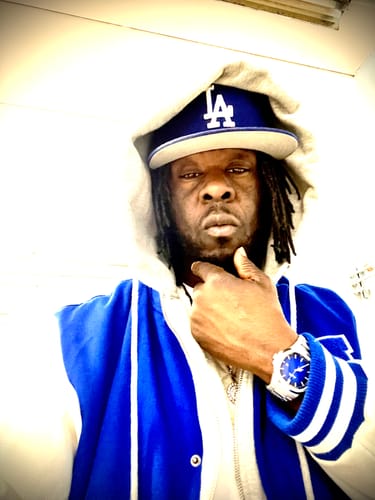 Customer showing their silver Lucky Fours® Caspian watch with a blue dial.