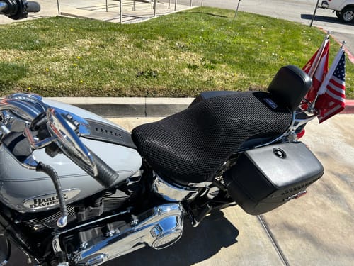Customer's black mesh Wind Rider Seat Cover installed on a silver motorcycle.
