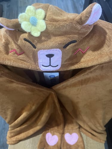 Close-up of the customer's capybara hooded towel, showing the detailed face with a yellow flower on the hood.