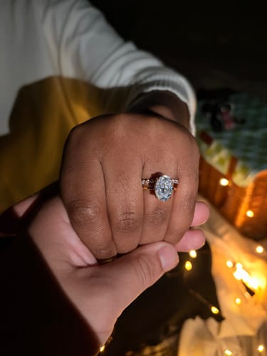 Customer photo review of Solitaire 5.5Ct Oval Cut Yellow Gold Moissanite Wedding Ring Set With Round Cut Wedding Band