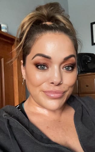 Reviewer's face with glowing, hydrated skin showing results of using The Freedom Face Whip.