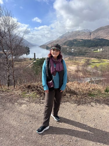 Customer wearing the Ellie Wide Leg Pants in a scenic, mountainous landscape.