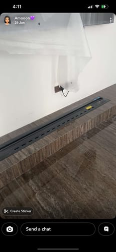 Customer's decorative electric fireplace installed in a dark wood console, shown before being turned on.