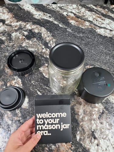 Reviewer's Mason Genie® Vacuum Sealer Kit components displayed on a countertop with a mason jar and adapters.