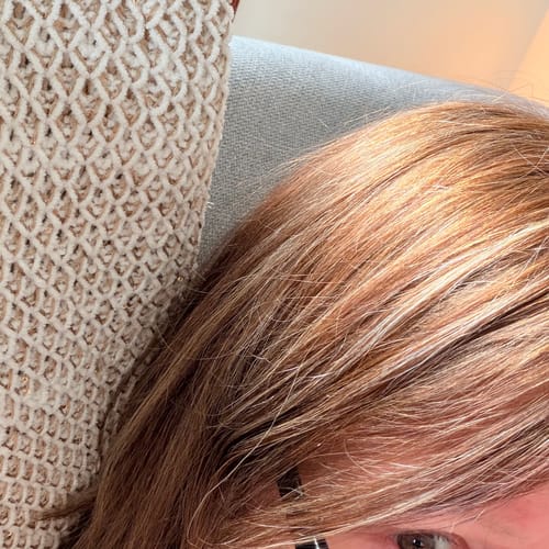 Close-up of a reviewer's silky and shiny hair after using the organic rosemary and keratin shampoo.