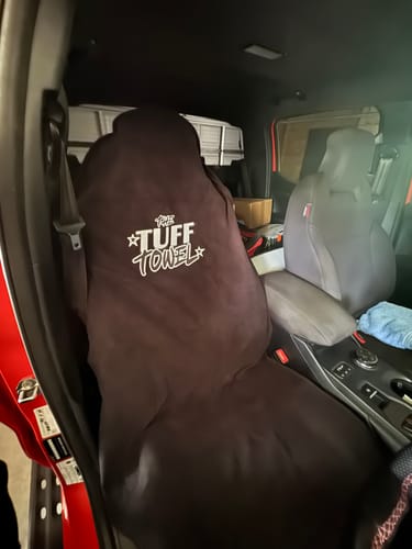 Customer's black Waterproof Car Towel Seat Cover fitted over a car seat, showing complete coverage.