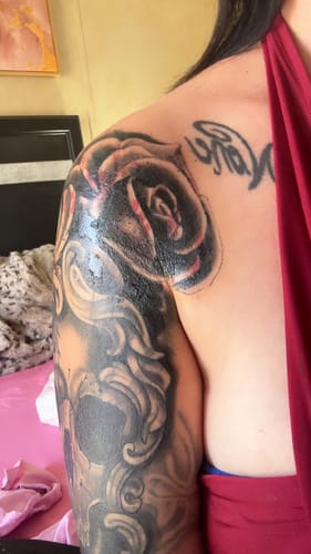 Customer showing a large, fresh tattoo on their shoulder and arm after using The Painless All-Stars Kit.