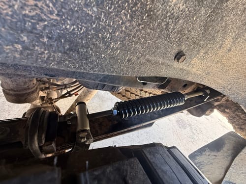 Close-up of a customer's HD Kit installed on the underside leaf spring of their Ford F-250.