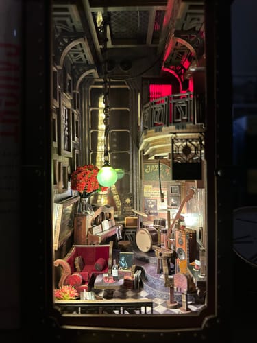 Customer's assembled Eternal Midnight Paris Book Nook Kit showing a detailed, warmly lit miniature jazz club.