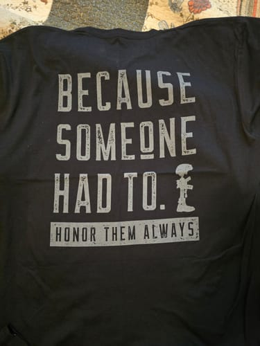 Customer's black T.V.P. Elite Membership t-shirt laid out, showing the 'Honor Them Always' graphic on the back.