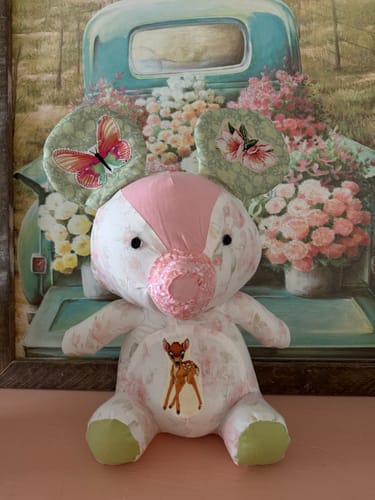 Customer's finished patchwork animal from the Mrs Quilty Subscription Box, featuring floral fabrics and a fawn design on its belly.