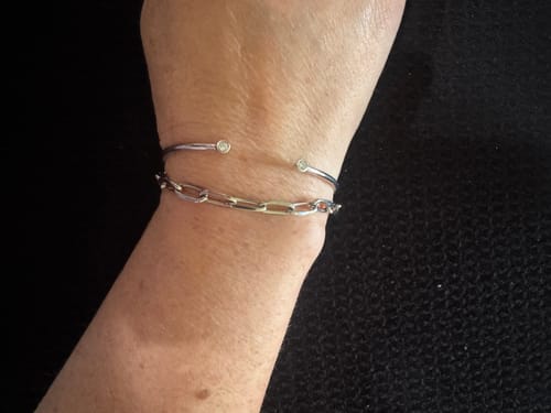 Reviewer wearing the shiny 5mm Paper Clip Chain Bracelet on their wrist, paired with a thin bangle.