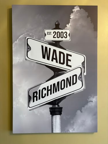 Customer's personalized black-and-white canvas showing street signs with the names 'Wade,' 'Richmond,' and 'Est. 2003'.