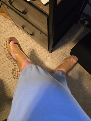 Reviewer's point-of-view wearing the Miss Carley Caramel Combo Wedges with blue sweatpants indoors.