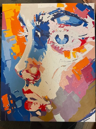 Customer's Vibrant Abstract Portrait paint by numbers kit, shown in progress with bold colors partially filled in.