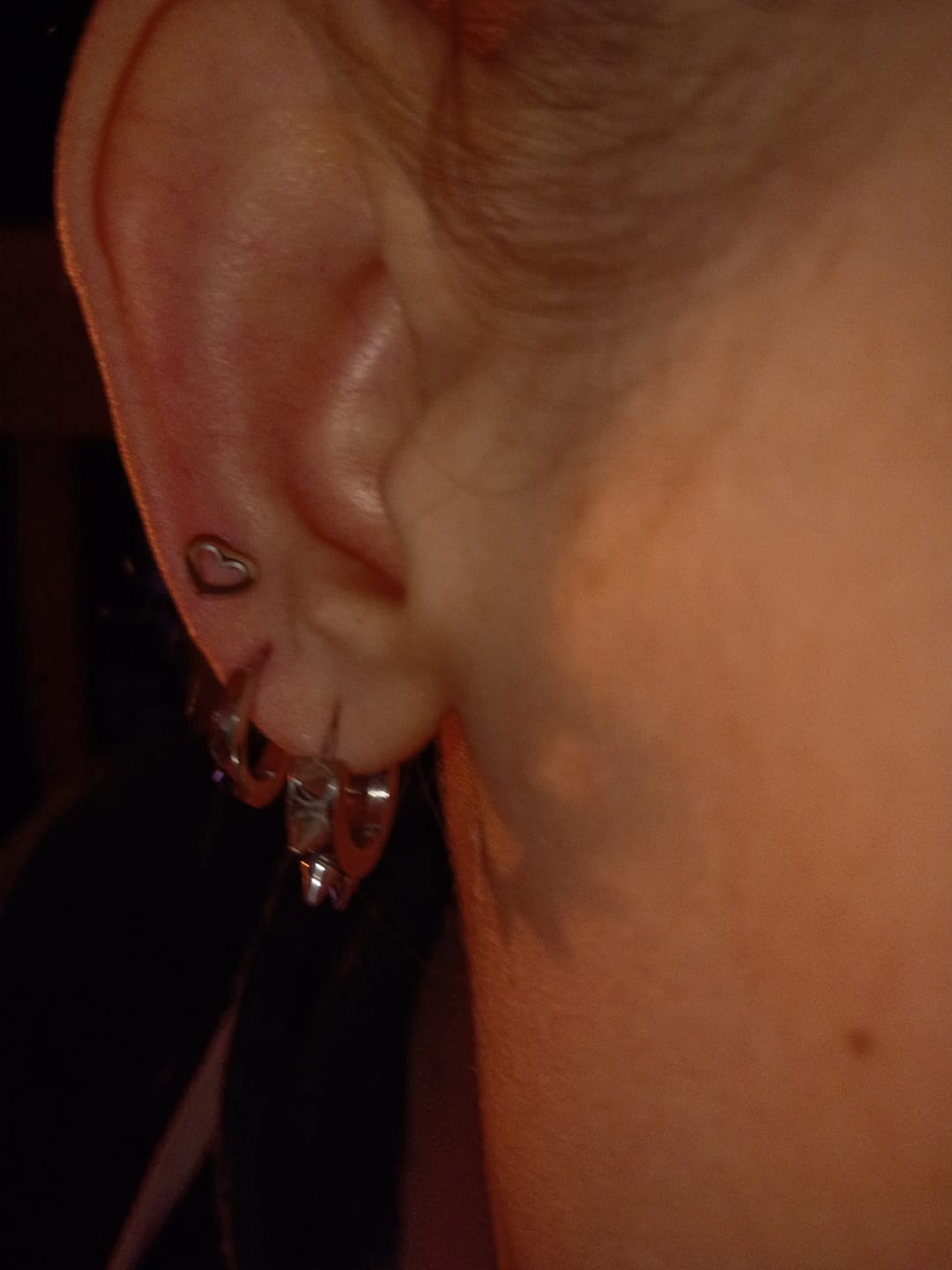 Customer photo review of Mini Hollow Heart Studs
