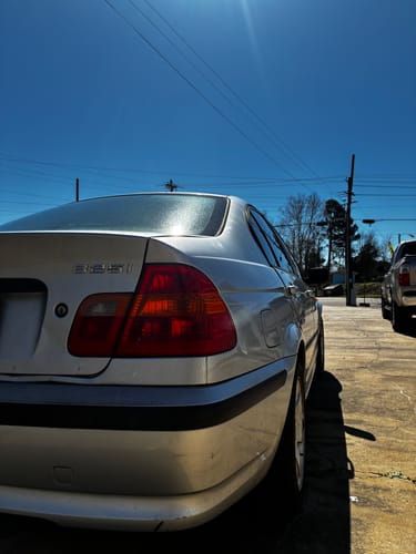 Customer's silver BMW 325i showing the rear wheel fitment after installing the 20mm wheel spacers.