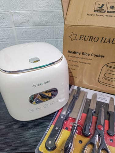 Customer's cream-colored Eurohauz Healthy Rice Cooker with the free knife set and its original box.