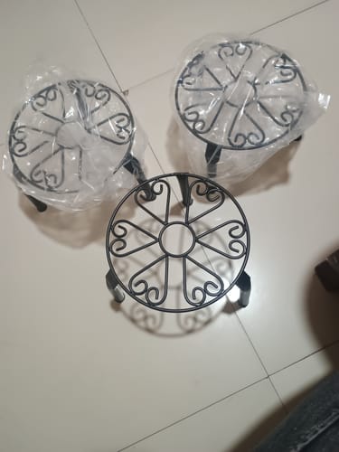 Customer photo review of UnitedCrafts Trivia Metal Pot Stand High Quality & Unique Design