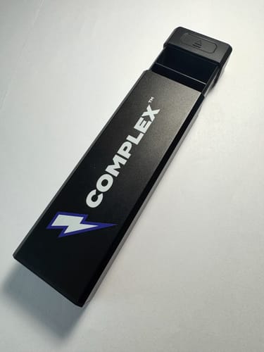 Customer's black Complex Weekly Planner supplement organizer, shown slightly open on a white surface.