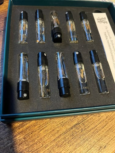 Customer's open Discovery Set, showing ten small perfume samples arranged in two rows.