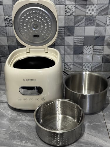 Customer's off-white Eurohauz Rice Cooker, open, with its stainless steel inner pot and starch-draining basket beside it.