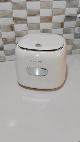 Customer's white Eurohauz Healthy Rice Cooker on a countertop, showing its minimalist design against a tiled wall.