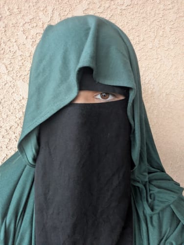 Close-up of a customer wearing the Evergreen Premium Maxi Jersey Hijab.