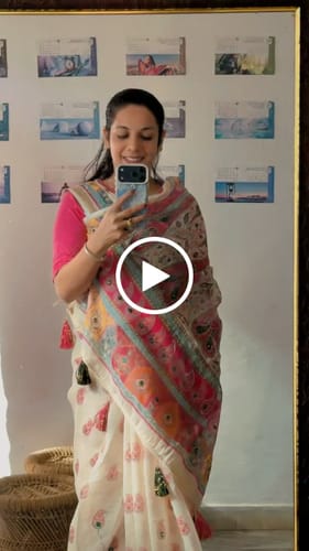 Customer video review of Offwhite Linen Saree Adorned with Paisley Prints and Elegant Embroidery Design