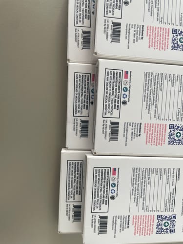 Customer's photo showing a side view of several stacked Just Blue™ product boxes.