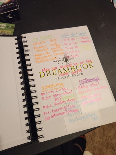 Customer's open 2026 Dreambook + Planner, showing a page with colorful, handwritten notes for goal setting.