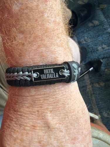 Customer wearing the black and grey Until Valhalla Paracord Bracelet on their wrist.