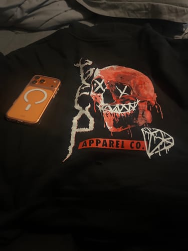 Reviewer's black hoodie showing a red skull graphic with 'X's for eyes.