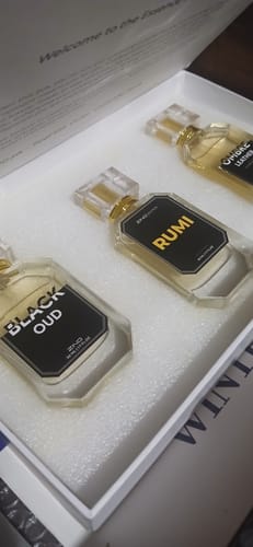 Customer's OUD Supreme BUNDLE showing three glass perfume bottles with black labels inside the white box.