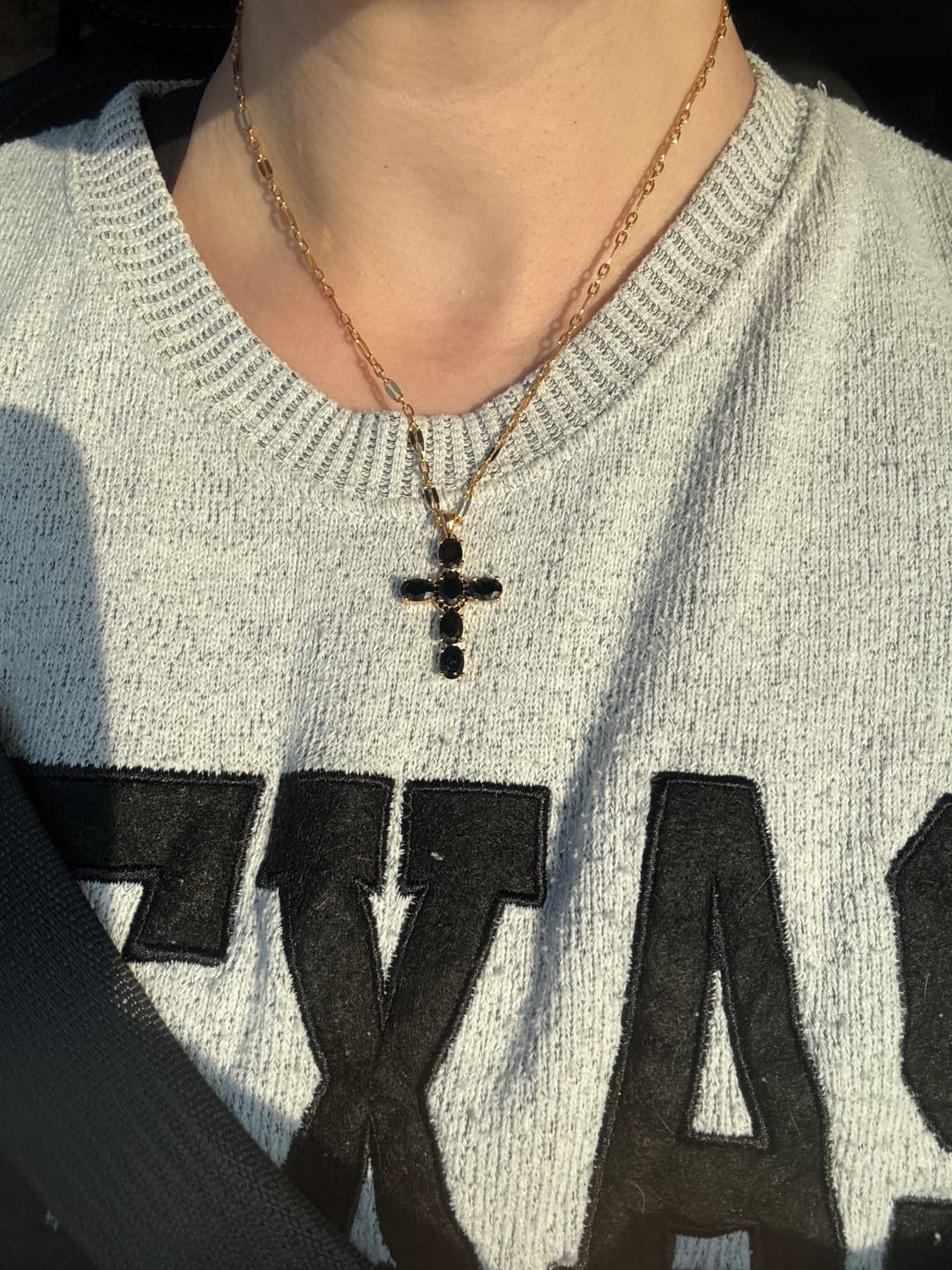 Customer photo review of Noir Cross Necklace