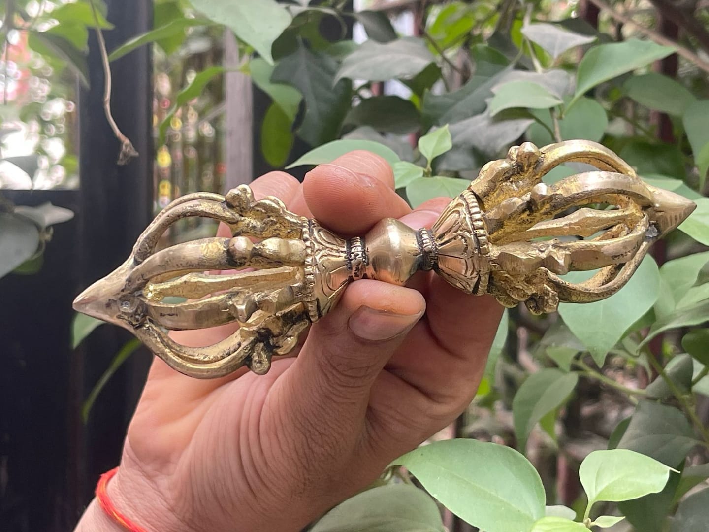 Customer photo review of Brass Vajra Dorje Ritual Tool Vastu Remedy for Protection, Tibetan Meditation and Home Temple Energy 15.7 x 4 cm | 340 gm