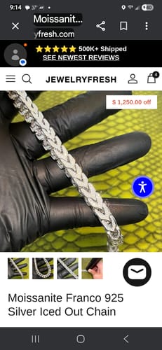 Customer holding the sparkling Moissanite Franco silver chain in a gloved hand.