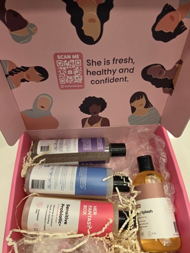 Customer's Postpartum Care Package unboxed, showing the various bottles of washes and oils in a pink box.
